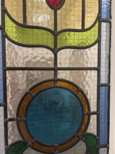 Art Nouveau stained glass fire door panels close up, Archway Health, Market Harborough