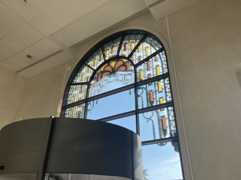 Arched window with stained glass border