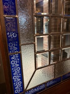 Close-up of bevelled and textured glass in a leaded door panel
