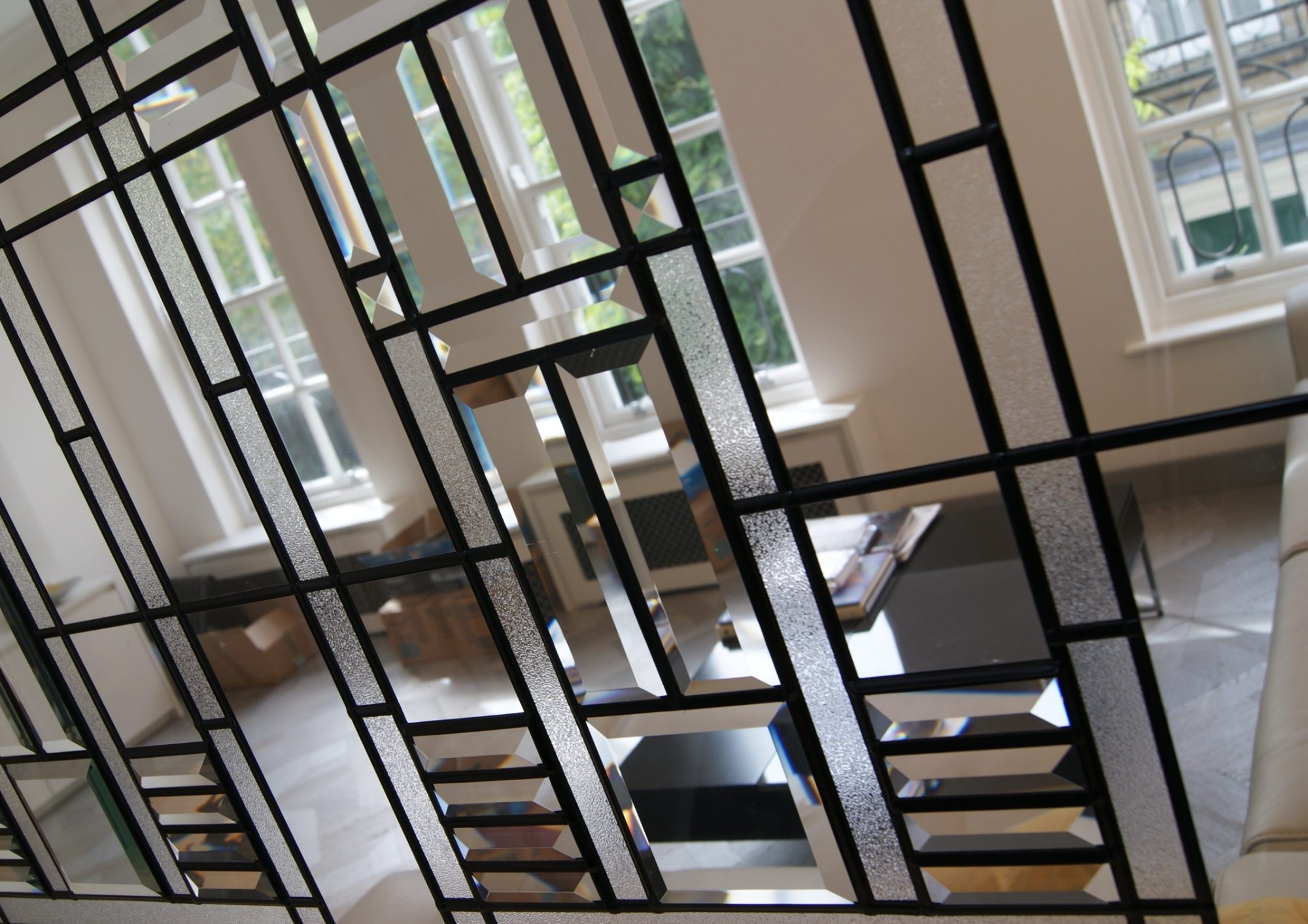 Bevelled glass feature window with clear and textured panels in a lead lattice