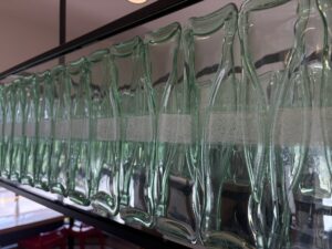 Bottle shaped kiln formed glass close up