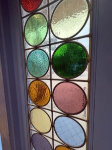 Coloured glass roundels close up
