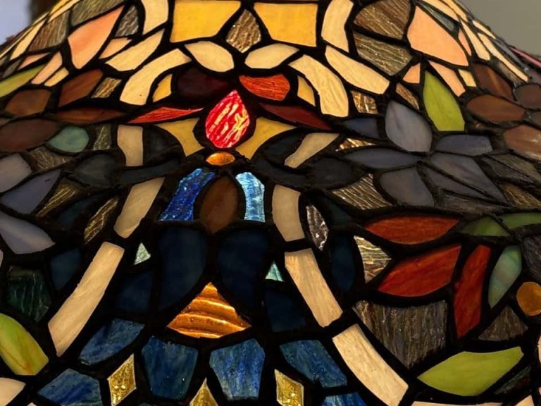 Floral panels of a copper foil stained glass lamp in opalescent glass