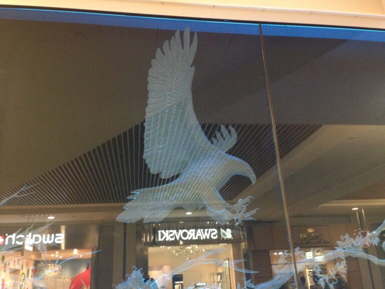 Deep carved eagle panel in a shopping arcade
