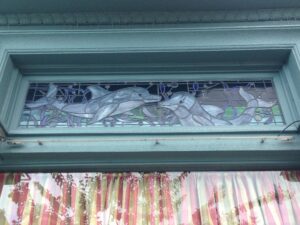 Dolphin transom over a doorway closer view