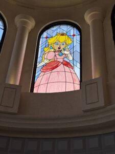 Arched window with a princess in a pink gown in leaded stained glass
