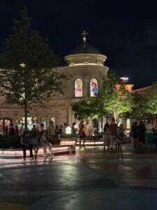 Domed building with lit stained glass windows at night