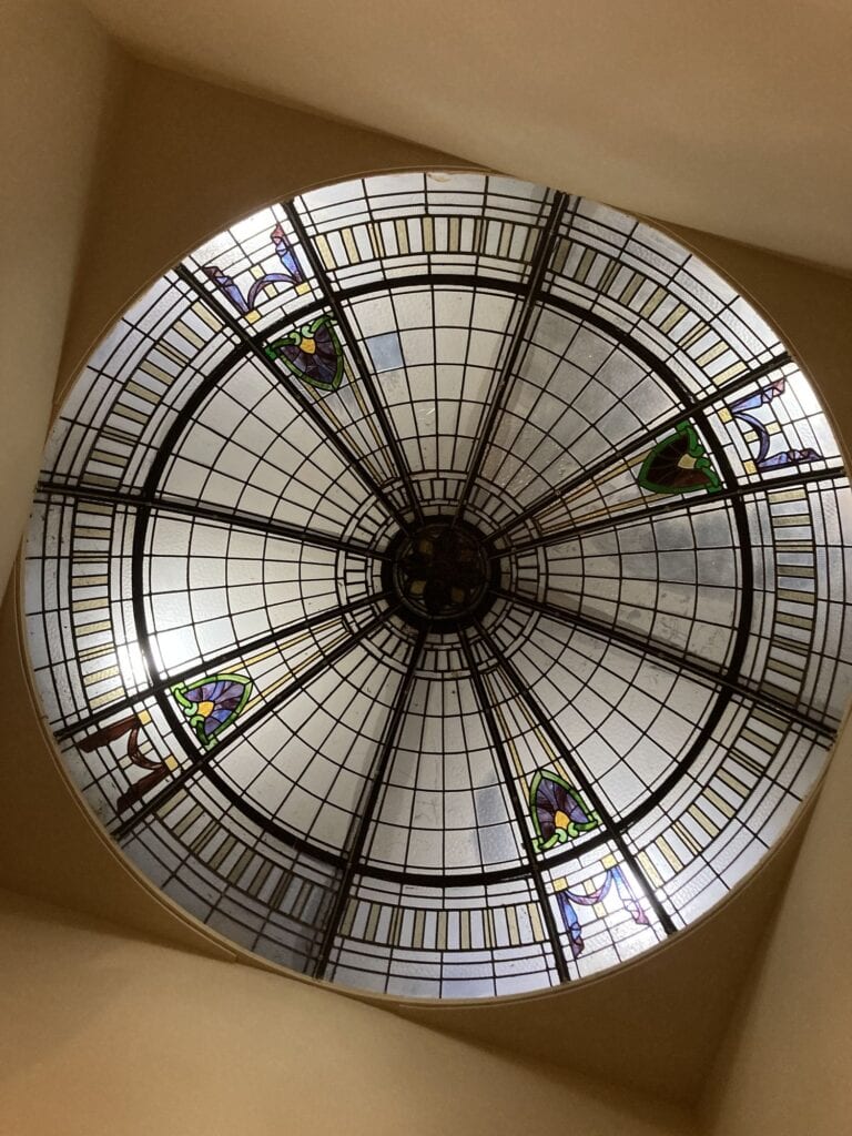 Domed glass ceiling with small coloured panels