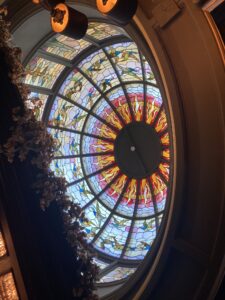 Domed stained glass ceiling from below at an angle