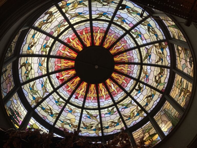 Domed stained glass ceiling with radiating panels