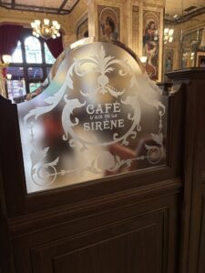 Etched glass screen scrollwork and lettering side