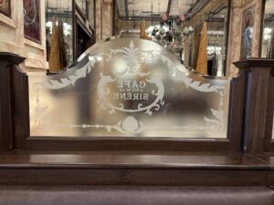 Etched glass screen scrollwork and lettering wide