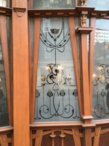Etched glass window with scrolling flower design in timber frame 2