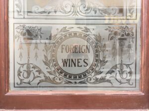 Etched panel with oval lettering and scrolls close up