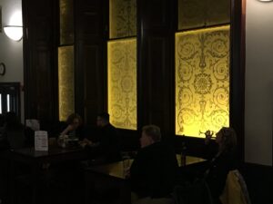 Etched window panels lit from behind in a bar
