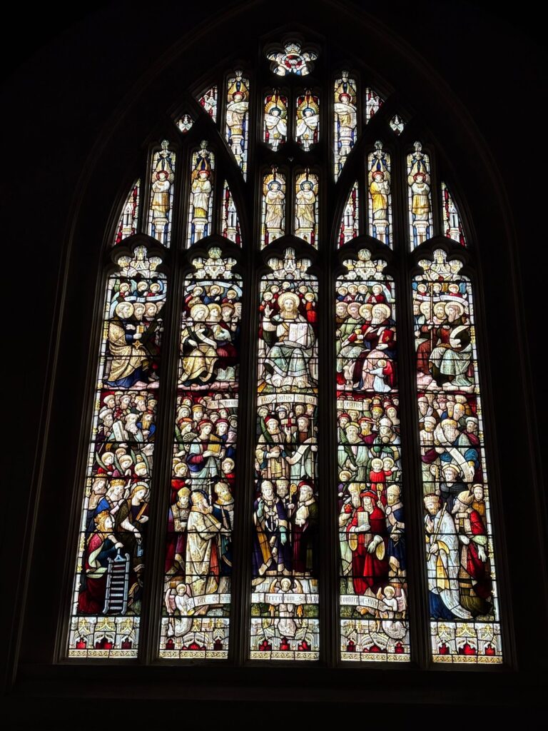 Five-light Perpendicular church window with tiers of stained glass figures, Chippenham