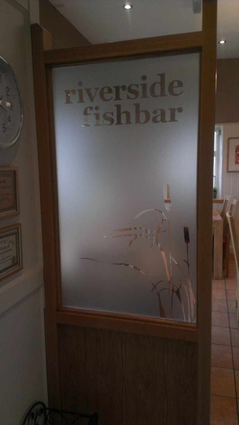 Frosted glass panel with reeds and lettering