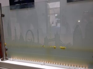 Glass screen with sandblasted city skyline wider view