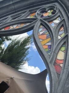 Gothic arch tracery coloured glass close up