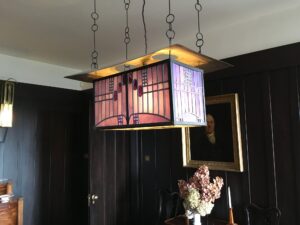 Hanging lantern with pink glass panels side view