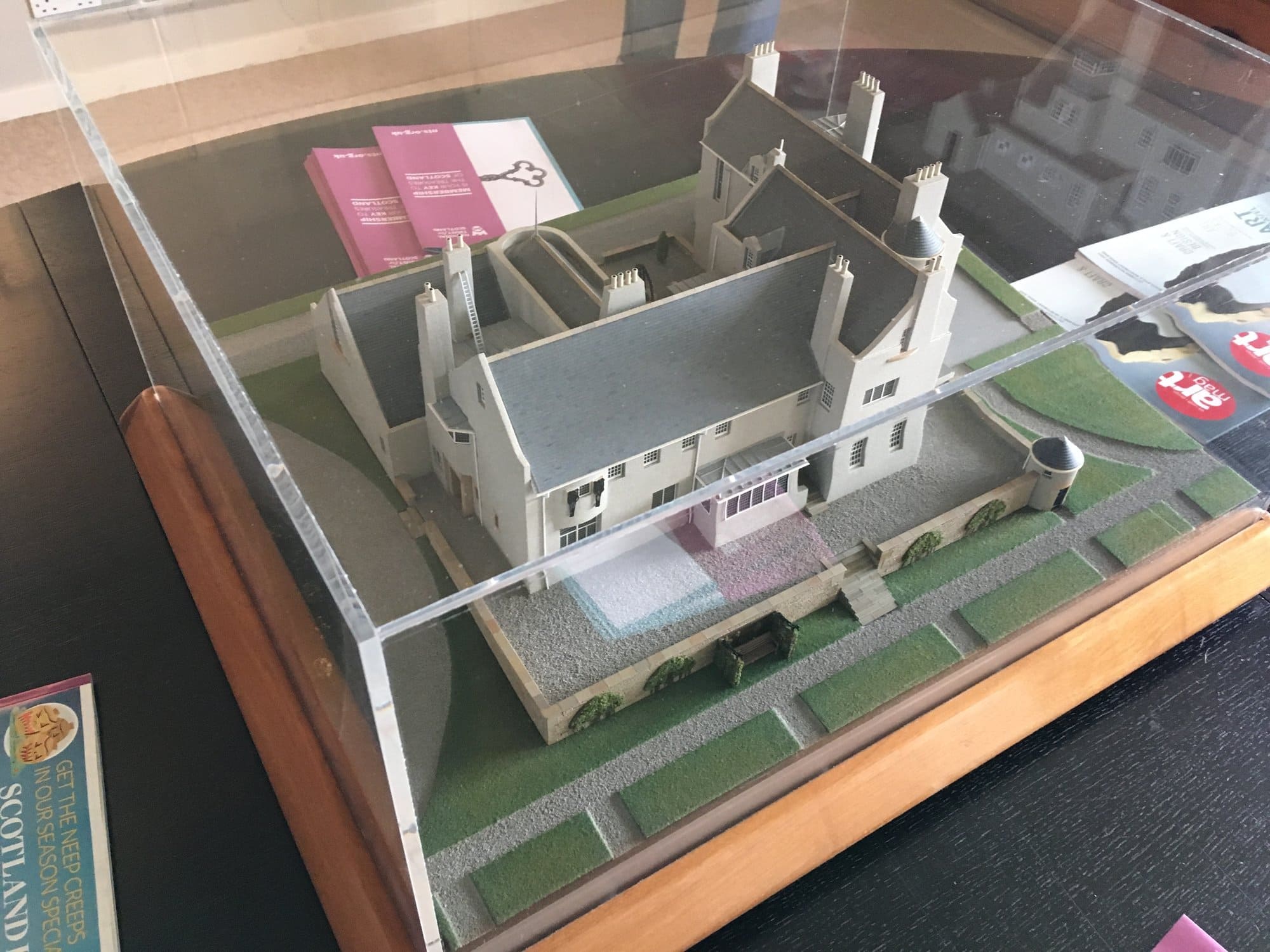 A model of Hill House and its grounds in a glass case