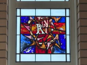 Hospice chapel window red and blue panel with lettering northampton