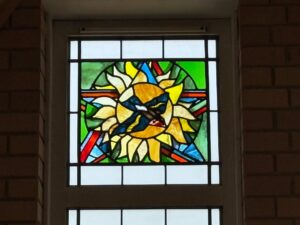 Hospice chapel window sunflower and bird panel northampton