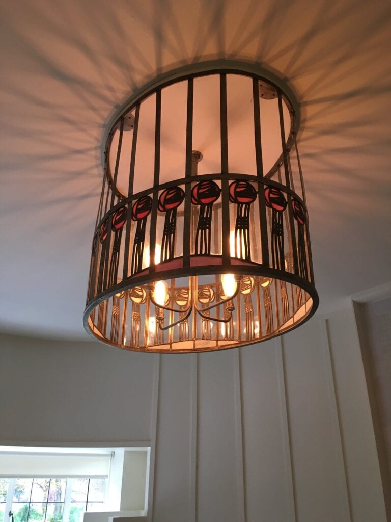 Ceiling light with a band of roses at House for an Art Lover