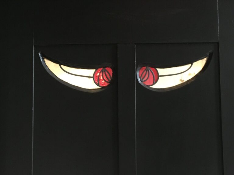 Pair of door panels with crescent shapes and roses at House for an Art Lover