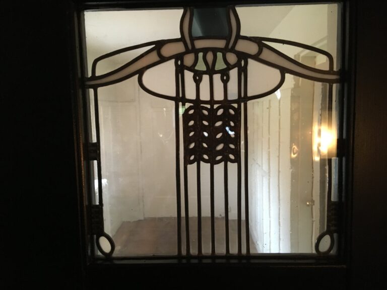 Leaded glass panel with a stylised plant motif at House for an Art Lover