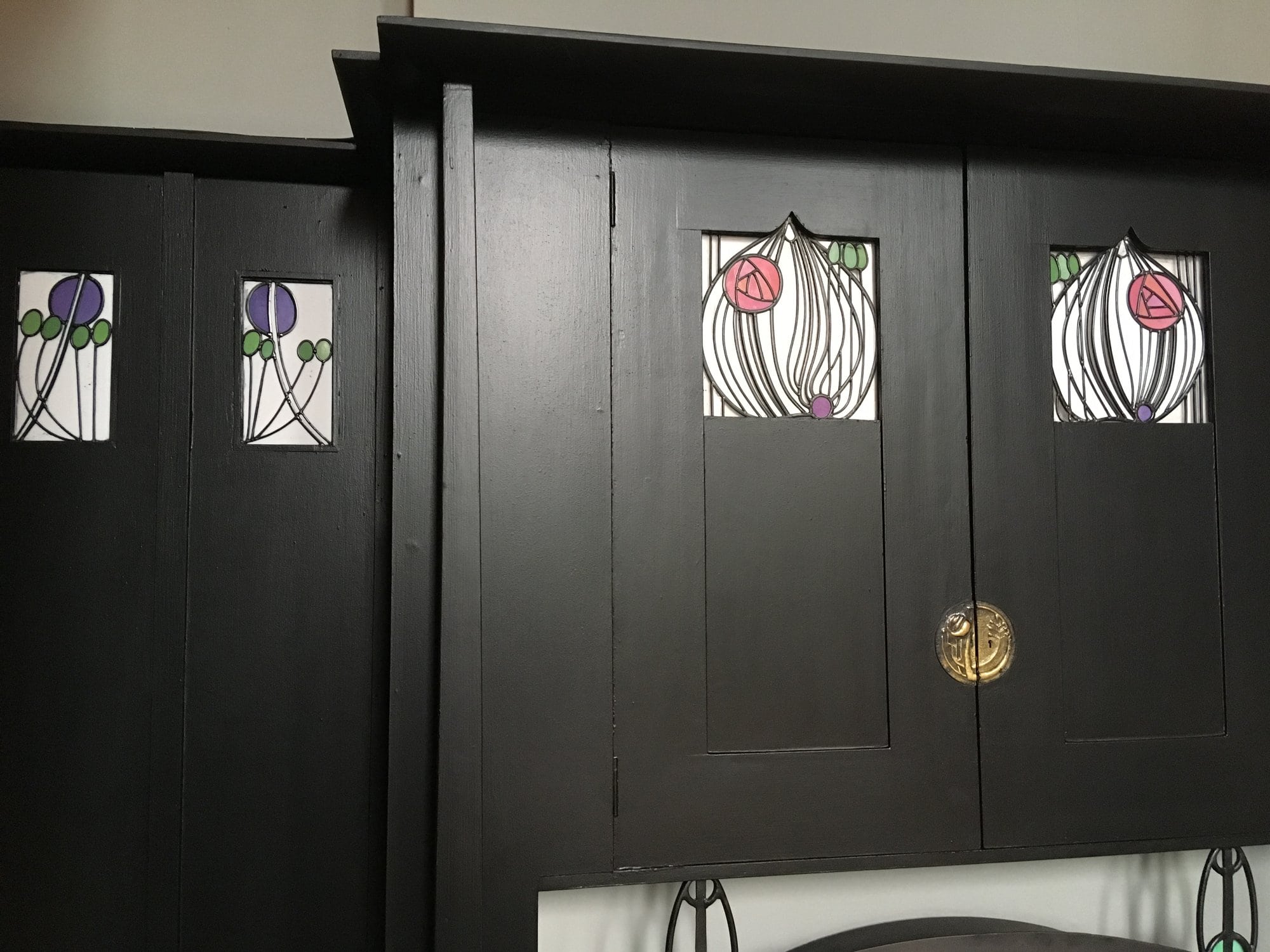 Panelled doors with rose motifs in leaded glass at House for an Art Lover