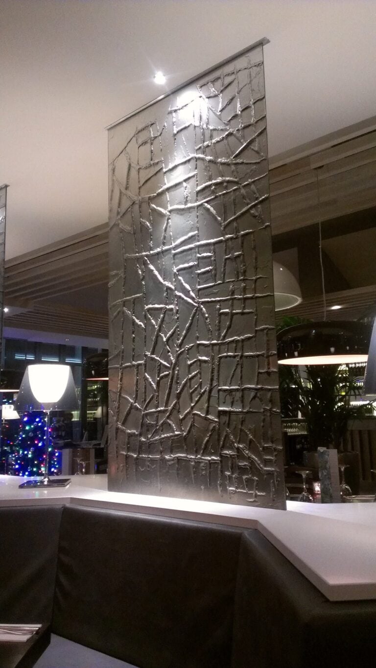 Tall hanging kiln formed glass panel with a heavily textured, cracked-ice relief surface, Prezzo, Kettering