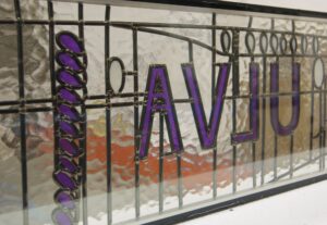 Lettered panel with purple letters and drops overlay