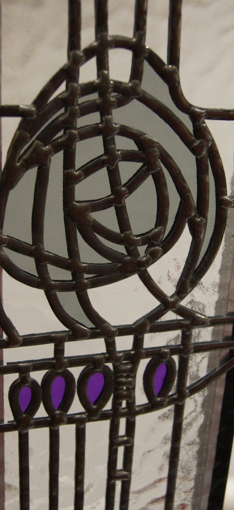 Mackintosh style rose panel in overlay stained glass with purple buds below the rose