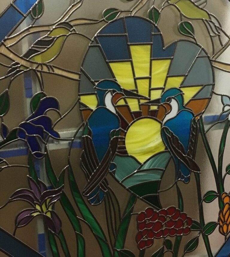 Octagonal window with birds and flowers in overlay stained glass