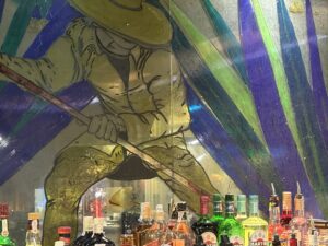 Painted agave glass wall figure with hat and tool
