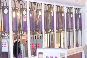 Purple leaded window panels above a table