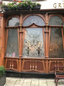 Row of etched glass windows in timber shopfront