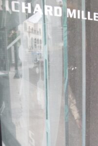 Sandblasted glass edge and shop window reflections