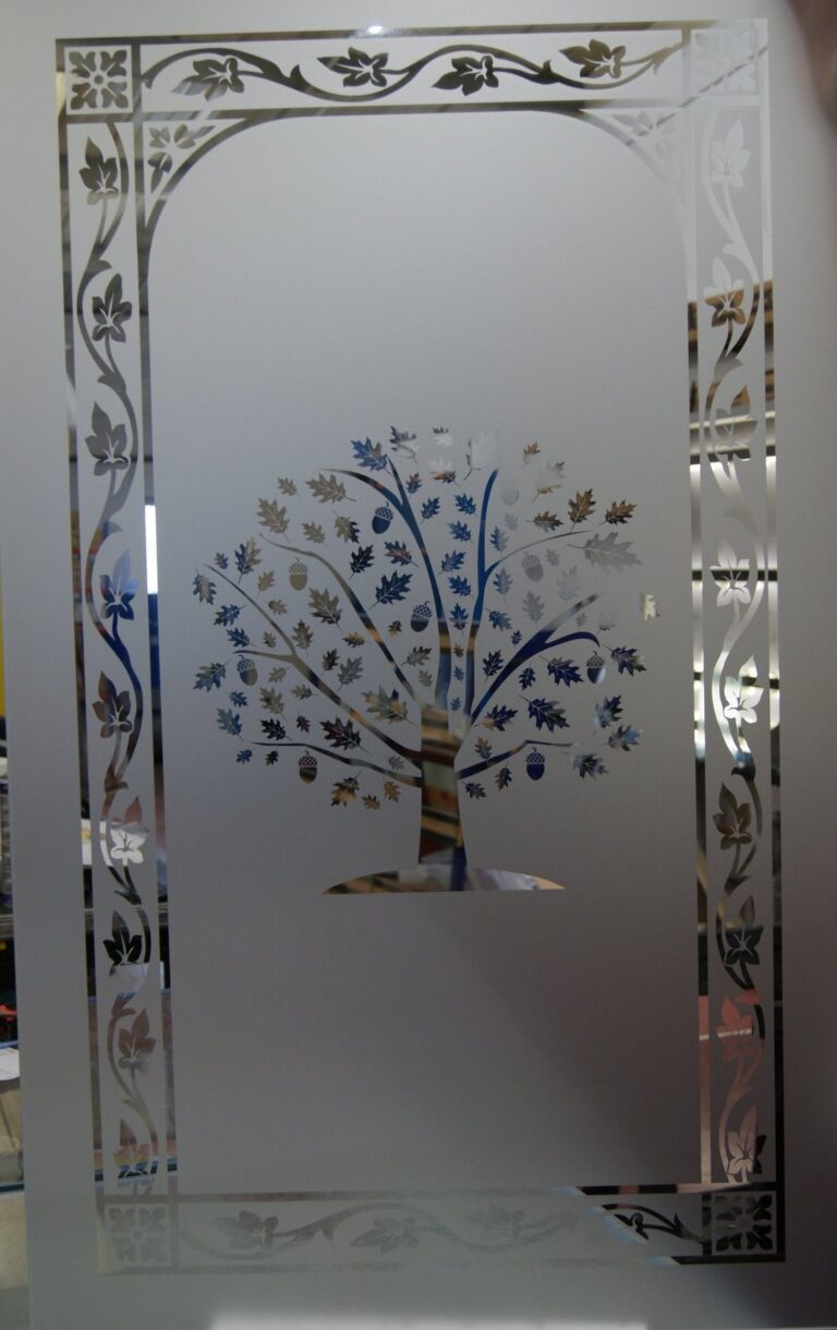 Oak tree with acorns inside a leaf border, sandblasted on a glass panel