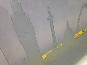 Sandblasted skyline screen close up with tall tower