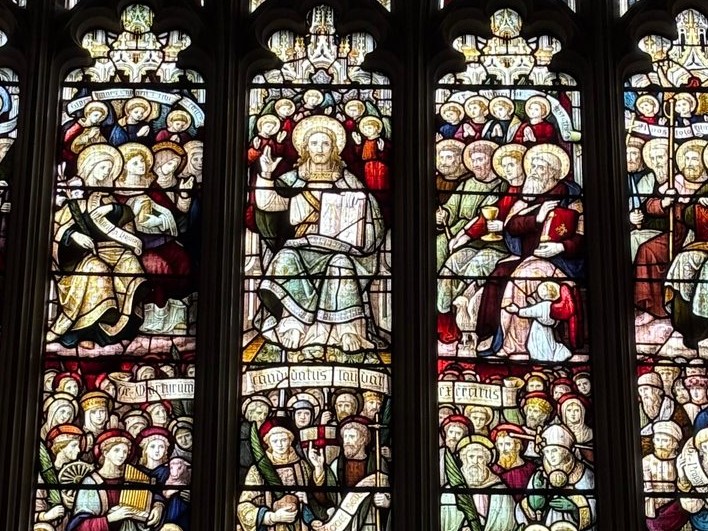 Detail of figures in a Victorian Perpendicular-style church stained glass window