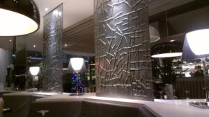 Textured cast glass columns above a bar counter