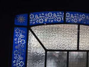 Textured quarry glass in lead with a blue floral border