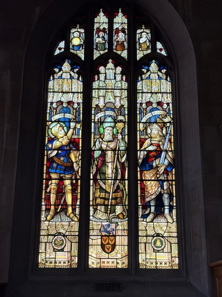 Three-light church window with three armoured saints, Chippenham