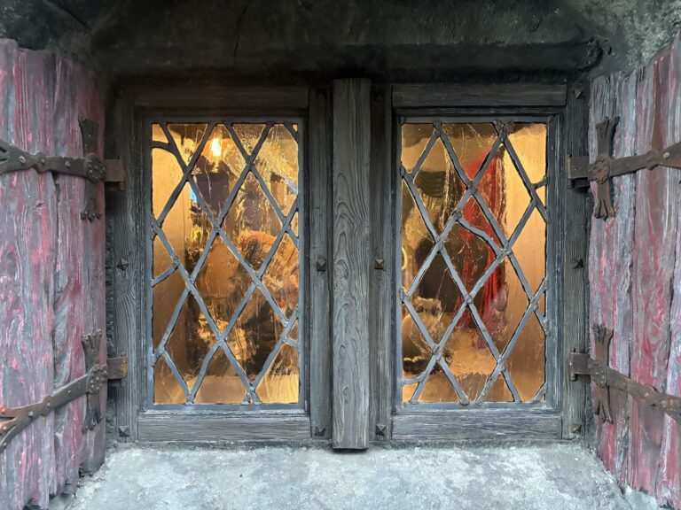 Weathered casement windows with diamond leaded lights