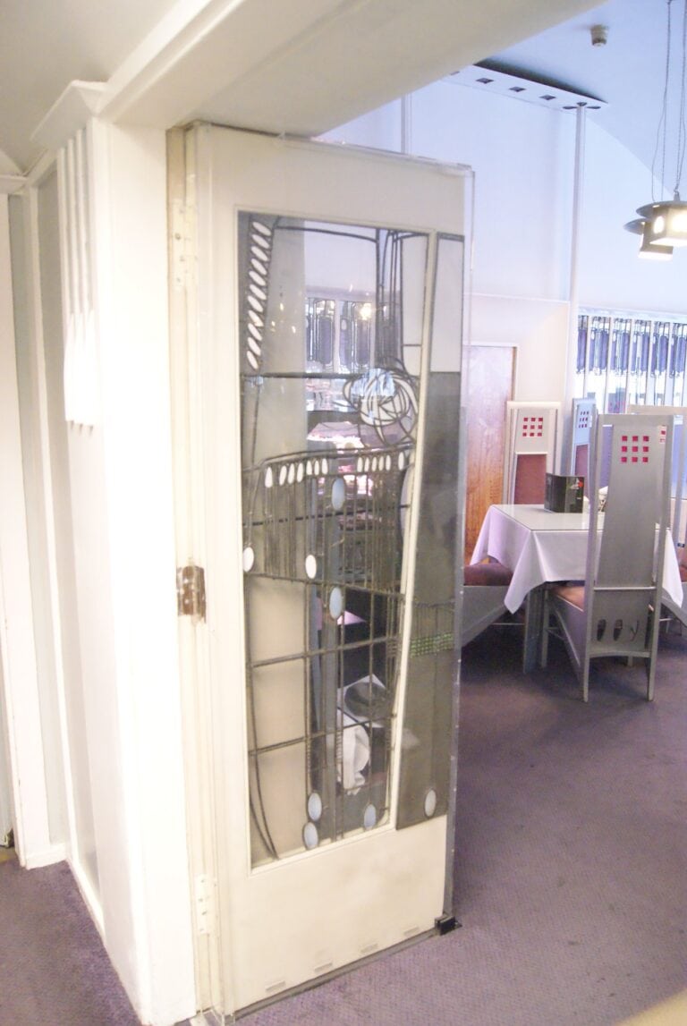 Glazed door with a Mackintosh rose in lead lines at the Willow Tea Rooms, photographed in 2013